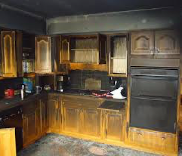 Soot and fire damage in kitchen.